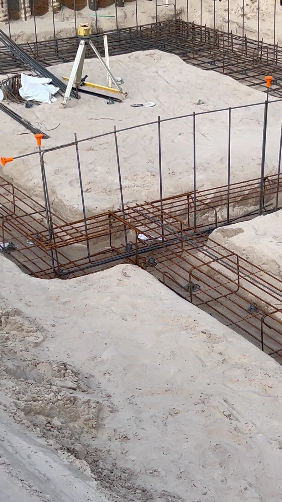 Trench mesh and footing steel sitting in sandy ground ready for the pour
